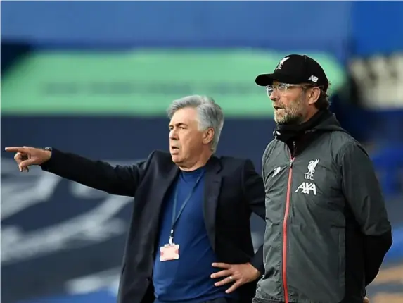  ?? (Getty) ?? Carlo Ancelotti (left) and Jurgen Klopp watch as their teams play out a draw