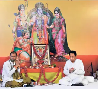  ??  ?? KAMAL NATH (right), former Madhya Pradesh Chief Minister and State Congress president, offering prayers at his residence in Bhopal on the eve of the bhumi pujan at Ayodhya.