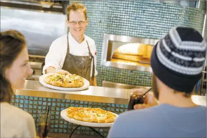  ?? Courtesy Taos Ski Valley ?? The 192 restaurant at The Blake in Taos Ski Valley features wood-fired pizza and eclectic tapas. The restaurant, like many around the state, is having a hard time finding and keeping culinary staff. It is partnering with University of New Mexico-Taos’ culinary program to address the problem.