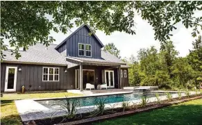  ??  ?? Lauren and Will Prestridge’s modern-day farmhouse, which sits on 2¼ acres in Cleveland, features a backyard retreat, complete with a stunning pool.