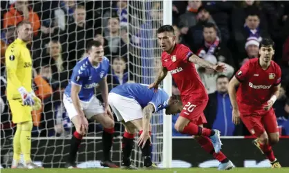  ??  ?? Bayer Leverkusen’s Chilean midfielder Charles Aránguiz (second right) celebrates after scoring his side’s second goal in their 3-1 Europa League last-16 victory against Rangers at Ibrox. Photograph: Scott Heppell/AP