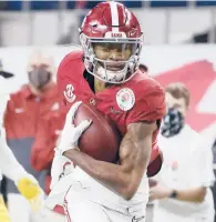  ?? MICHAEL AINSWORTH/AP ?? WR DeVonta Smith had seven catches for 130 yards and three TDs in the Crimson Tide’s semifinal win.