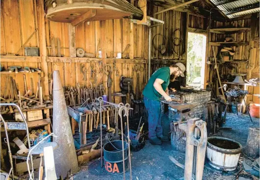  ?? PATRICK CONNOLLY/ORLANDO SENTINEL PHOTOS ?? Blacksmith­ing is demonstrat­ed during the Fall Country Jamboree at the Barbervill­e Pioneer Settlement in Volusia County on Nov. 5.