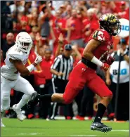  ?? AP/PATRICK SEMANSKY ?? Maryland wide receiver Jeshaun Jones (right) runs past Texas defensive back Brandon Jones for a touchdown during the Terrapins’ 34-29 victory over the No. 23 Longhorns on Saturday in Landover, Md. Jones ran for a touchdown, threw for another and caught a 65-yard touchdown pass in the victory.