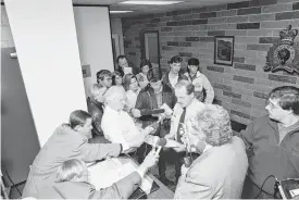  ?? CAPE BRETON POST FILE ?? RCMP officer Doug Roper speaks with reporters during a press conference at the Sydney office on May 8, 1992. Media came from across Canada to report on the crime, possibly the deadliest robbery in Nova Scotian history at the time.