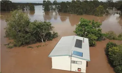  ?? Photograph: Darren England/EPA ?? A house inundated by the swollen Mary River in the town of Tiaro, about 200km north of Brisbane.