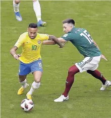  ??  ?? Brazil’s Neymar (left) dribbles past Mexico’s Hector Herrera (right) as Brazil’s Filipe Luis looks on them during the round of 16 match between Brazil and Mexico at the 2018 World Cup.