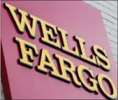  ?? MATT ROURKE — THE ASSOCIATED PRESS FILE ?? Federal regulators are fining Wells Fargo $1 billion for abuses tied to its auto lending and mortgage businesses.