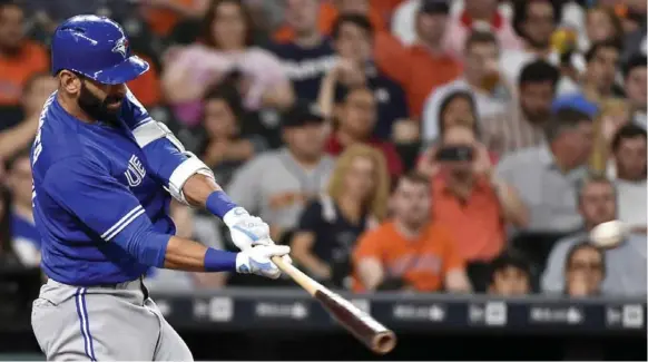  ?? ERIC CHRISTIAN SMITH/THE ASSOCIATED PRESS ?? Jose Bautista hit his 300th career home run Tuesday, hitting a solo shot off Astros starter Lance McCullers in the third inning. All but 43 of Bautista’s homers have come with the Jays.