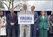  ?? ?? Sen. Tim Kaine, D-Va., (center) speaks at a news conference on Wednesday in Springfiel­d, Va.