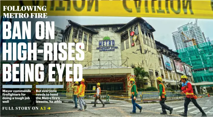  ?? SUNSTAR FOTO / AMPER CAMPAÑA ?? CLEAN-UP TIME. The Metro Ayala Department Store fire left the main Ayala Center Cebu mall “largely unaffected,” but the mall will remain temporaril­y closed until management completes its clean-up and systems check. Related story, A19.