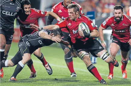  ?? Photo: Iain McGregor/Fairfax NZ ?? Shark repellent: A bloodied Richie McCaw fends off a Sharks defender in last night’s Super Rugby semi in Christchur­ch. The Crusaders now have a chance to win Todd Blackadder his first title as a coach.
Crusaders: Sharks: Ht:
MVP:
BIG MOMENT:
ALL...