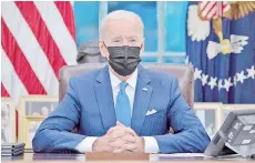  ?? AFP file photo — ?? Biden speaks from the Resolute Desk prior to signing executive orders related to immigratio­n in the Oval Office of the White House in Washington, DC.