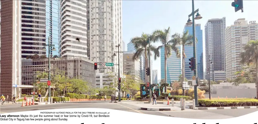  ?? PHOTOGRAPH BY ALFONSO PADILLA FOR THE DAILY TRIBUNE @tribunephl_al ?? Lazy afternoon Maybe it’s just the summer heat or fear borne by Covid-19, but Bonifacio Global City in Taguig has few people going about Sunday.