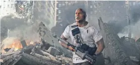  ?? WARNER BROS. ?? Dwayne Johnson saves Chicago, and does a lot for the industry, with “Rampage.”