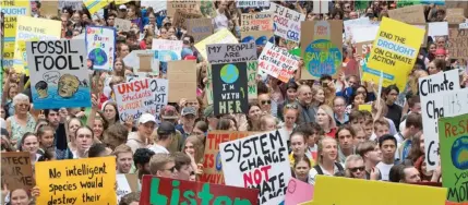  ??  ?? Australian students participat­ing in a climate action march earlier this year.