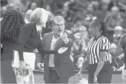  ?? COURANT FILE ?? Uconn coach Geno Auriemma and associate head coach Chris Dailey argue a call with a referee during a game in February 2020. Women’s basketball officials will be paid the same as men’s basketball officials in the NCAA Tournament beginning in 2022, the NCAA announced Friday.