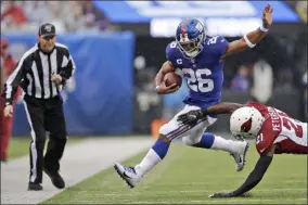  ?? ADAM HUNGER - THE ASSOCIATED PRESS ?? Arizona Cardinals’ Patrick Peterson, right, defends against New York Giants’ Saquon Barkley during the first half of an NFL football game, Sunday, Oct. 20, 2019, in East Rutherford, N.J.