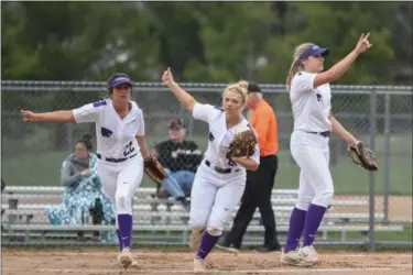  ?? ERIC BONZAR —THE MORNING JOURNAL ?? Keystone pitcher Sydney Campbell, right, signals two outs after striking out her second North Canton Hoover batter of the inning.