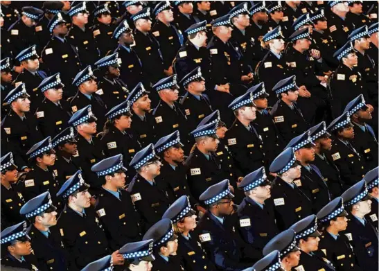  ?? JOSE M. OSORIO/CHICAGO TRIBUNE ?? New Chicago police officers attend the department’s graduation and promotion ceremony in 2019 at Navy Pier’s Grand Ballroom.
