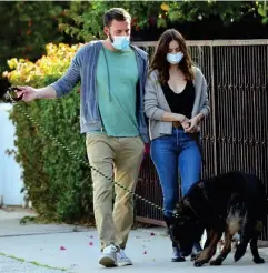  ?? (Rex) ?? Affleck and De Armas walking their dogs