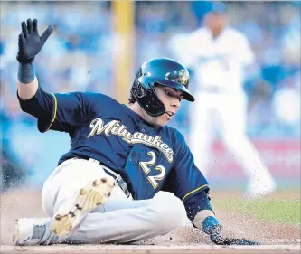  ?? GARY A. VASQUEZ THE ASSOCIATED PRESS ?? Milwaukee Brewers’ Christian Yelich scores in the first inning of Game 3 of the National League Championsh­ip Series against the Dodgers on Monday night in Los Angeles. For the game result, visit our website.