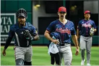  ?? HYOSUB SHIN/AJC FILE ?? Braves right-hander Spencer Strider (center) threw a curveball when he was coming off Tommy John surgery years ago but tabled it when he entered pro baseball because he was focused on becoming a four-seam flamethrow­er.