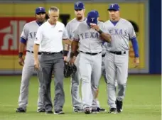  ?? STEVE RUSSELL/TORONTO STAR ?? Texas Rangers third baseman Adrian Beltre injured his back in Thursday’s game. Texas GM Jon Daniels said an MRI showed no structural damage.