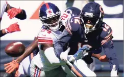  ?? Charles Rex Arbogast / Associated Press ?? Giants cornerback James Bradberry (24) defends Bears wide receiver Allen Robinson (12) on Sunday in Chicago.