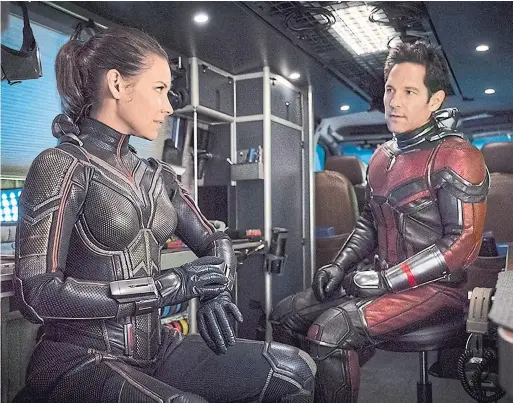  ?? BEN ROTHSTEIN/MARVEL STUDIOS/TRIBUNE NEWS SERVICE ?? Paul Rudd is more comic than heroic as Ant-Man, leaving most of the fight-scene action to Evangeline Lilly’s winsome Wasp, Peter Howell writes.