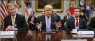  ?? PABLO MARTINEZ MONSIVAIS – ASSOCIATED PRESS ?? President Donald Trump speaks while hosting a breakfast with business leaders in the Roosevelt Room of the White House in Washington Monday. At left is Wendell P. Weeks, Chief Executive Officer of Corning, at right is Alex Gorsky Chairman and Chief Executive Officer of Johnson &amp; Johnson.