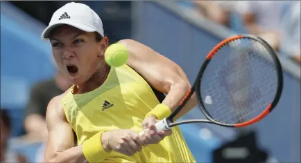  ?? John Minchillo ?? The Associated Press Simona Halep of Romania returns to Garbine Muguruza of Spain during the women’s singles final at the Western & Southern Open on Aug. 20 in Mason, Ohio. The U.S. Open draw has the two-time French Open runner-up Halep facing Maria...