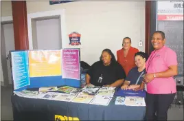  ??  ?? Case workers from the Charles County Department of Social Services hand out school supplies and informatio­n for students at the back to school jam held Aug. 9 at Regency Furniture Stadium in Waldorf.