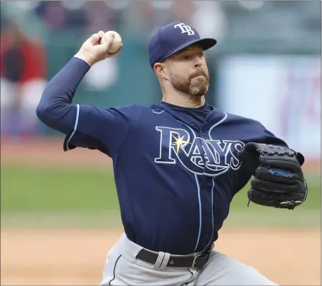  ?? RON SCHWANE — THE ASSOCIATED PRESS ?? Rays starting pitcher Corey Kluber delivers a pitch against the Cleveland Guardians during the first inning of a Sept. 27, 2022 game in Cleveland. Kluber will get the start in Boston’s season opener.