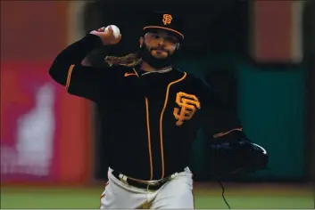  ?? JOSE CARLOS FAJARDO — BAY AREA NEWS GROUP FILE ?? San Francisco Giants pitcher Johnny Cueto (47) pitches against the San Diego Padres in the first inning of their game at Oracle Park in San Francisco on Sept. 26, 2020.