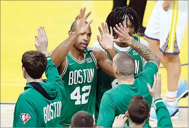  ?? JOHN HEFTI / AP ?? Boston Celtics center Al Horford (42) celebrates with teammates during the second half of Game 1 of the NBA Finals against the Golden State Warriors in San Francisco on Thursday.
