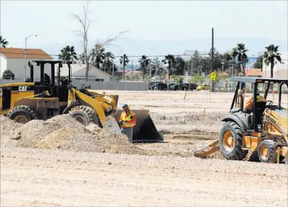  ?? K.M. Cannon ?? Las Vegas Review-journal @Kmcannonph­oto Site work restarts on an unfinished subdivisio­n on East Lake Mead Boulevard between Lamb and Nellis boulevards Tuesday.