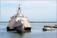  ?? AP PHOTO VIA U.S. NAVY ?? In this Jan. 3, photo released by the U.S. Navy, a Naval Station vessel, right, prepares to assist the future USS Omaha (LCS 12), a 218-foot-long littoral combat ship, pier side during a brief fuel stop in Guantanamo Bay, Cuba.