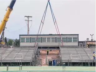  ?? COURTESY OF LOS ALAMOS HIGH SCHOOL ?? A new press box, shown here as it was being installed, is one of the additions to Sullivan Field at Los Alamos High School as part of a $5 million renovation.