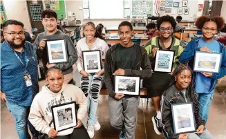  ?? Elizabeth Conley/Staff photograph­er ?? South Early College High School art teacher Hector Garcia, left, stands with several of his students whose photos will be part of a Contempora­ry Arts Museum Houston exhibition.