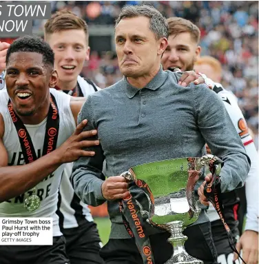  ?? GETTY IMAGES ?? Grimsby Town boss Paul Hurst with the play-off trophy