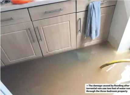  ??  ?? The damage caused by flooding after torrential rain saw two feet of water run through the three-bedroom property