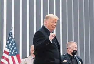  ?? ALEX BRANDON THE ASSOCIATED PRESS ?? U.S. President Donald Trump pumps his fist as he tours a section of the U.S.-Mexico border wall on Tuesday, in Alamo, Texas. “It’s time for peace and for calm,” he said.