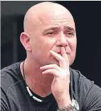  ?? Picture: AP. ?? Much to ponder: new coach Andre Agassi watches a “rusty” Novak Djokovic in action.
