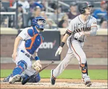  ?? FRANK FRANKLIN II — THE ASSOCIATED PRESS ?? The Giants’ Mike Yastrzemsk­i watches his hit go for a two-run home run as Mets catcher Patrick Mazeika watches Tuesday in New York.