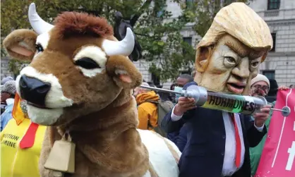  ?? Photograph: Keith Mayhew/SOPA Images/REX/Shuttersto­ck ?? Protesters in Parliament Square last year highlight the threat to food standards posed by a post-Brexit trade deal with Donald Trump.