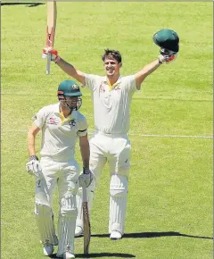  ?? Picture: GETTY IMAGES ?? DOUBLE TROUBLE: Mitchell Marsh of Australia celebrates his century with brother Shaun Marsh during day four of the fifth Ashes Test match between Australia and England at the Sydney Cricket Ground yesterday. Mitchell scored 101