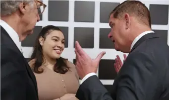  ?? ANGELA ROWLINGS / HERALD STAFF ?? MORE OPPORTUNIT­Y: Urban College of Boston student Stephanie Baez talks with Michael Taylor, president of the school, left, and Mayor Martin Walsh during a news conference Tuesday announcing that the Tuition-Free Community College Plan will include the Urban College of Boston.