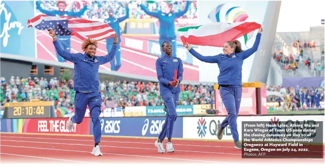  ?? Photos: AFP ?? (From left) Noah Lyles, Athing Mu and Kara Winger of Team US pose during the closing ceremony on Day 10 of the World Athletics Championsh­ips Oregon22 at Hayward Field in Eugene, Oregon on July 24, 2022.
