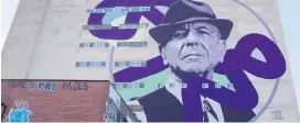  ?? THE CANADIAN PRESS ?? A mural of Leonard Cohen is one of two that have sprung up on buildings in the songer-songwriter’s hometown since his death last November.